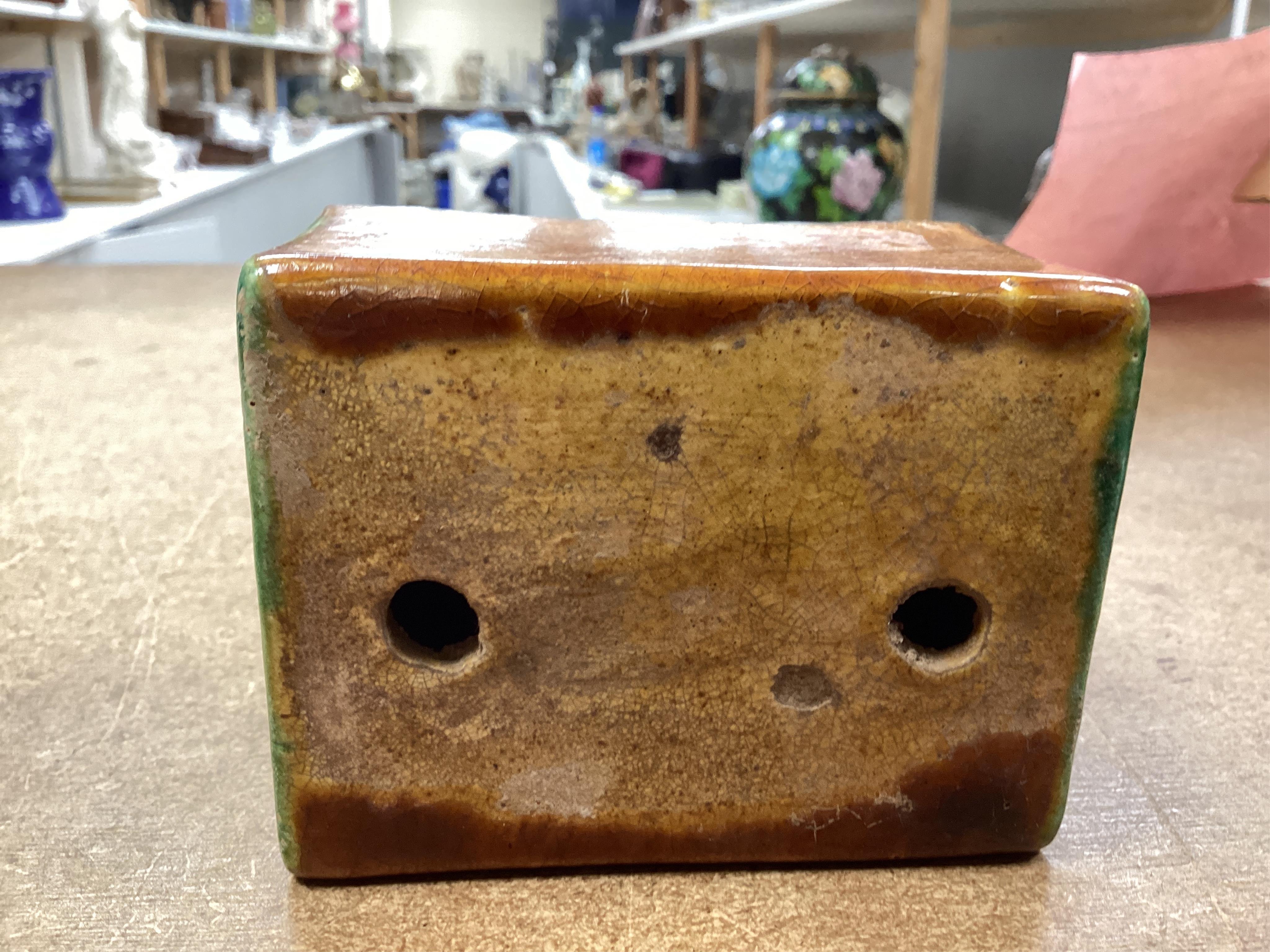 A Chinese stone ware arm rest, 10cm wide